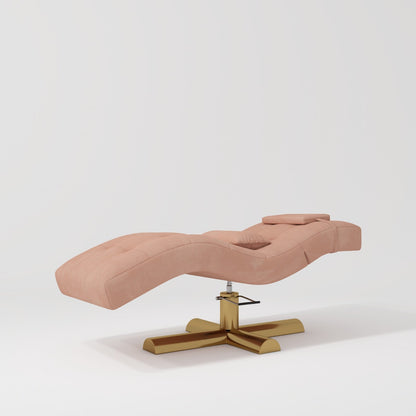 An adjustable beauty bed with black foam padding and Gold stainless steel legs, set against a white background.