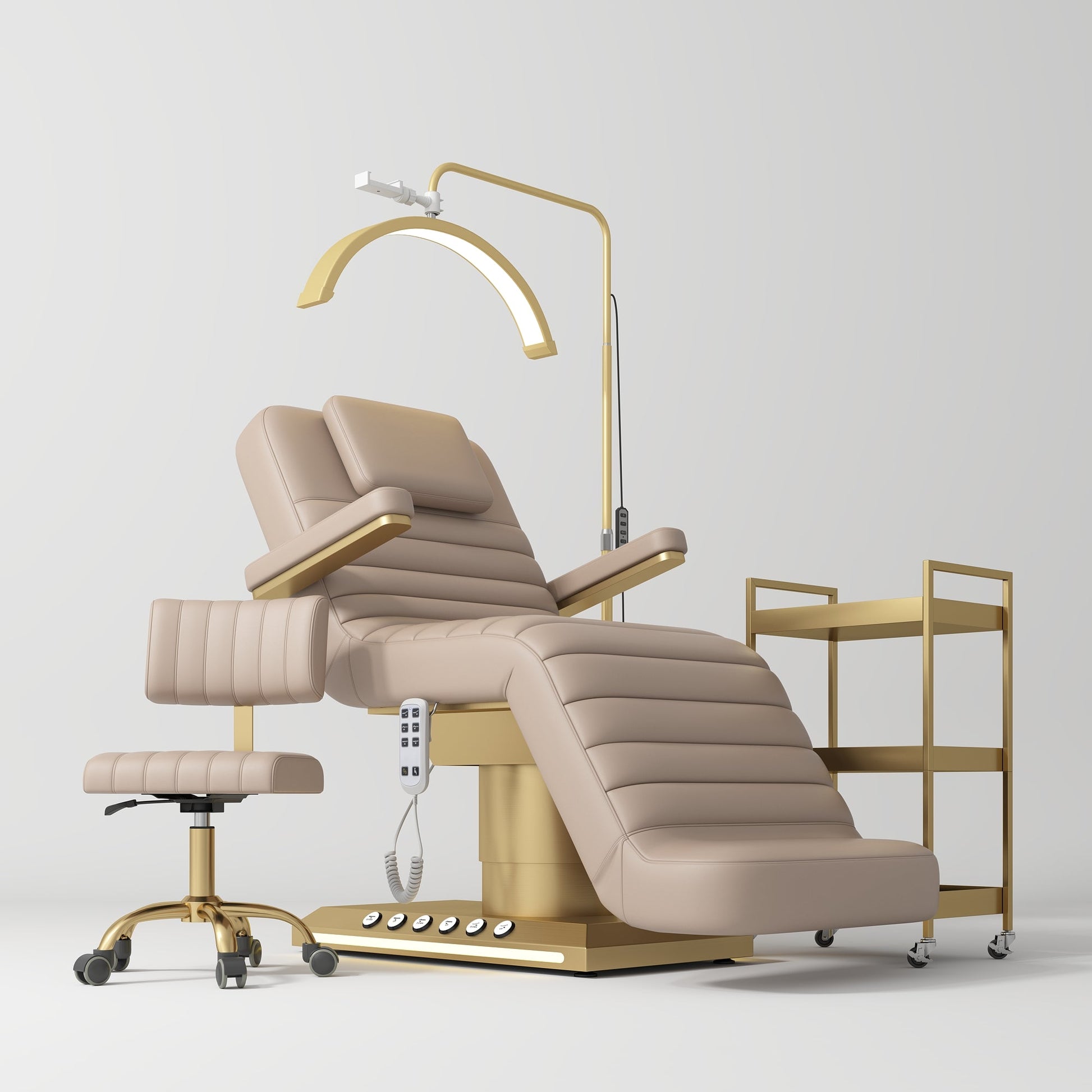 Beige and gold medical examination chair with a lamp and side table on a white background