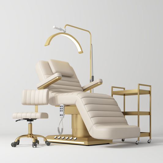 Beige and gold medical examination chair with a lamp and cart on a white background