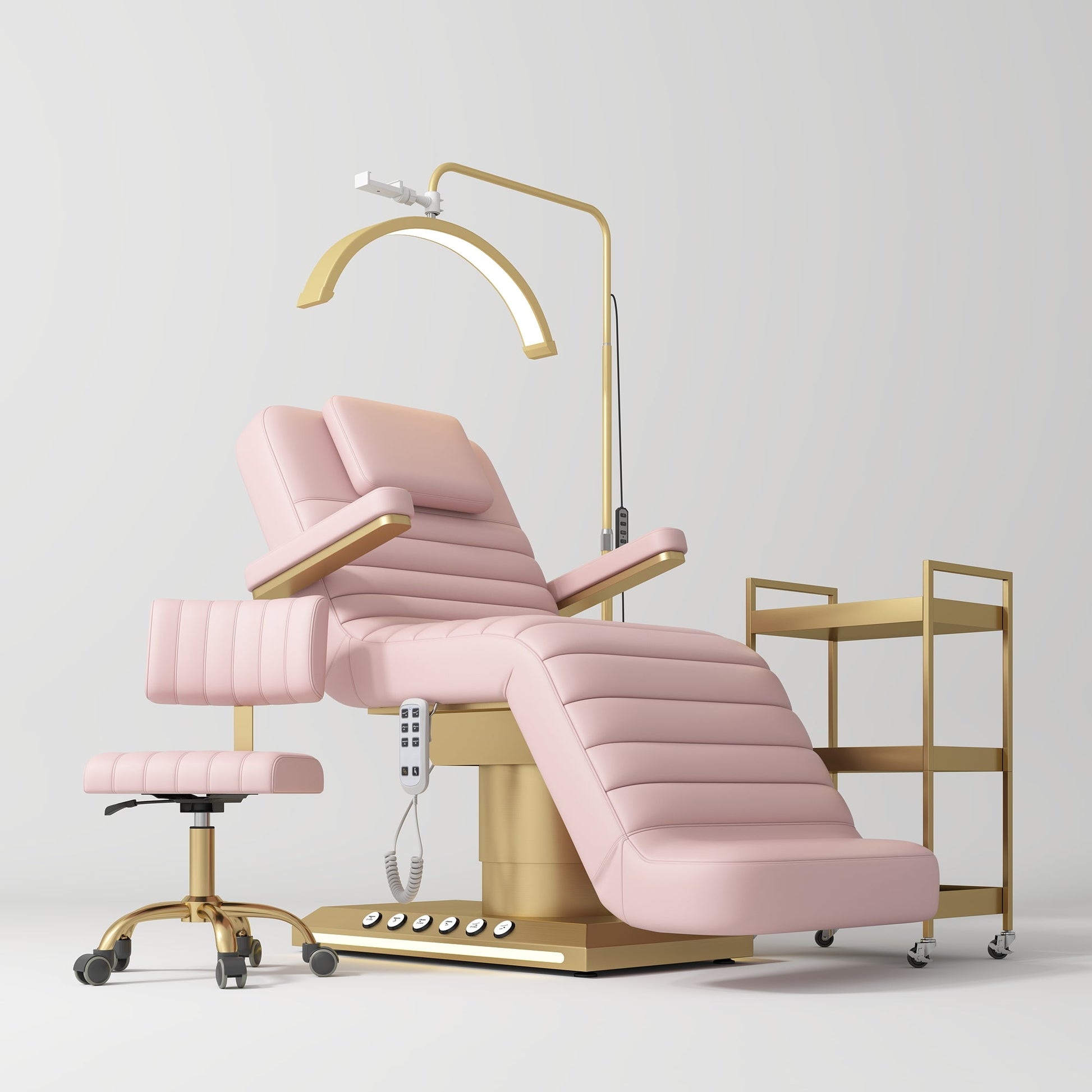 Pink pedicure chair with gold accents on a white background