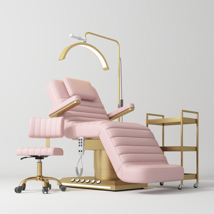 Pink pedicure chair with gold accents on a white background
