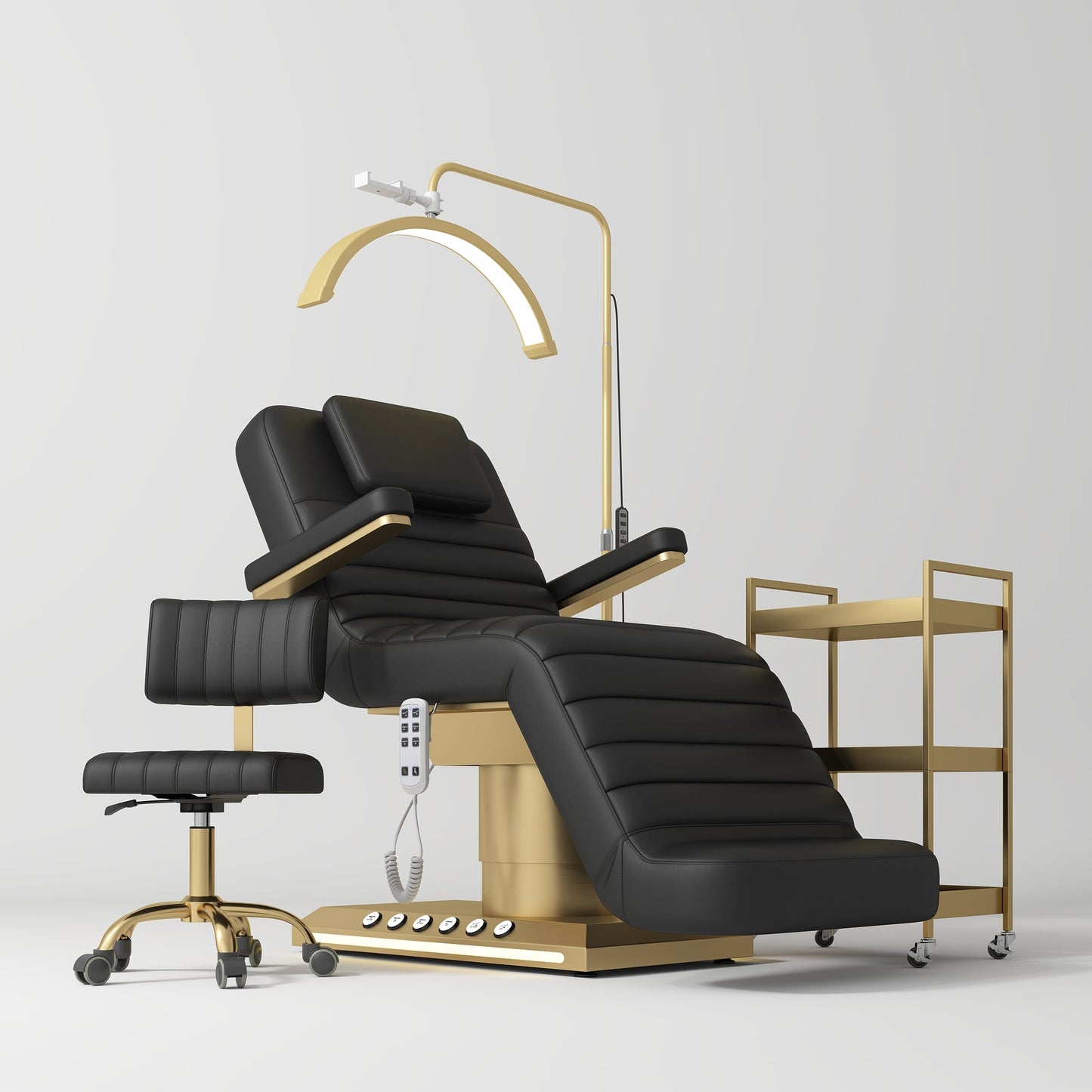 Black and gold reclining beauty chair with a lamp and side table on a white background